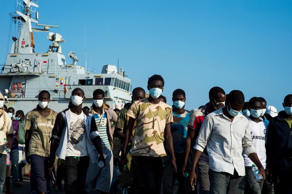 Migrants, asylum seekers and refugees mainly from Eritrea and Gambia land a few hours after being rescued from the sea.
