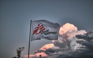 MSF flag waves with a blue sky in the background