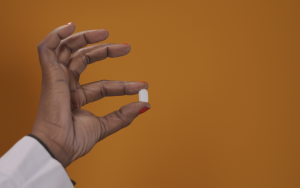 Person holding a pill