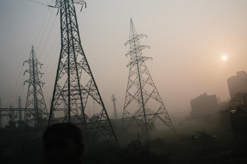 MSF232715 Smog rises above Kamrangirchar, a heavily polluted slum area in Dhaka 