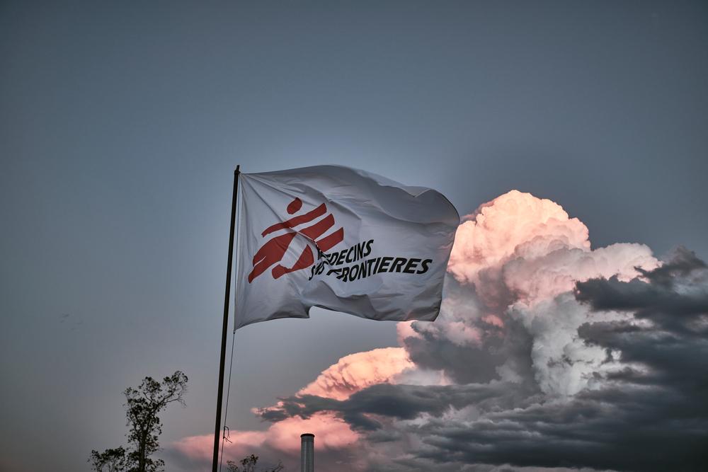 MSF flag waves with a blue sky in the background