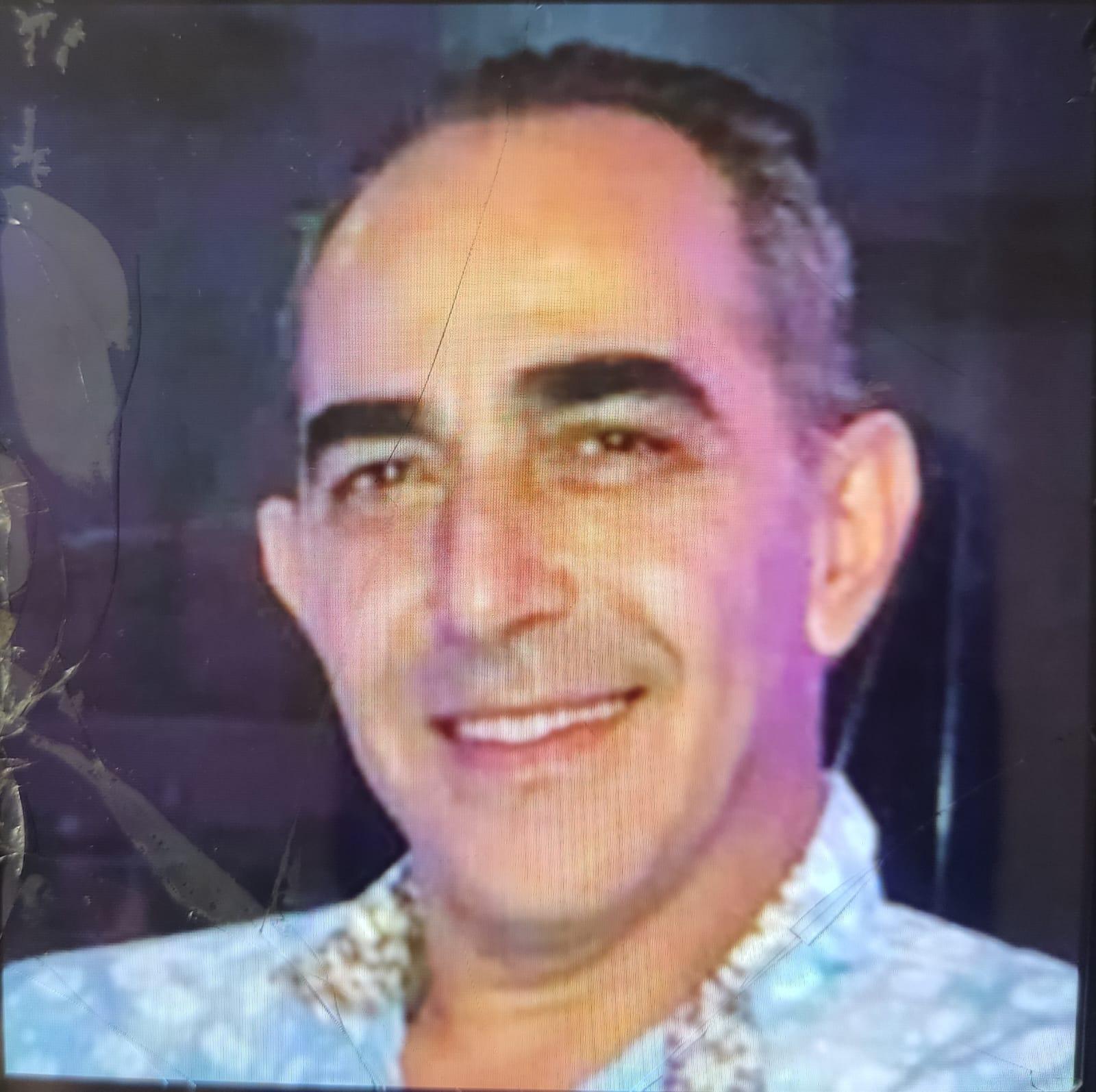 A portrait photo of Hussam Al Loulou